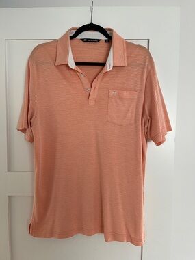 Travis Mathew Men’s medium golf polo orange/coral color with small white stripes